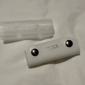 TUMI White Suitcase Handle with Metal Accents